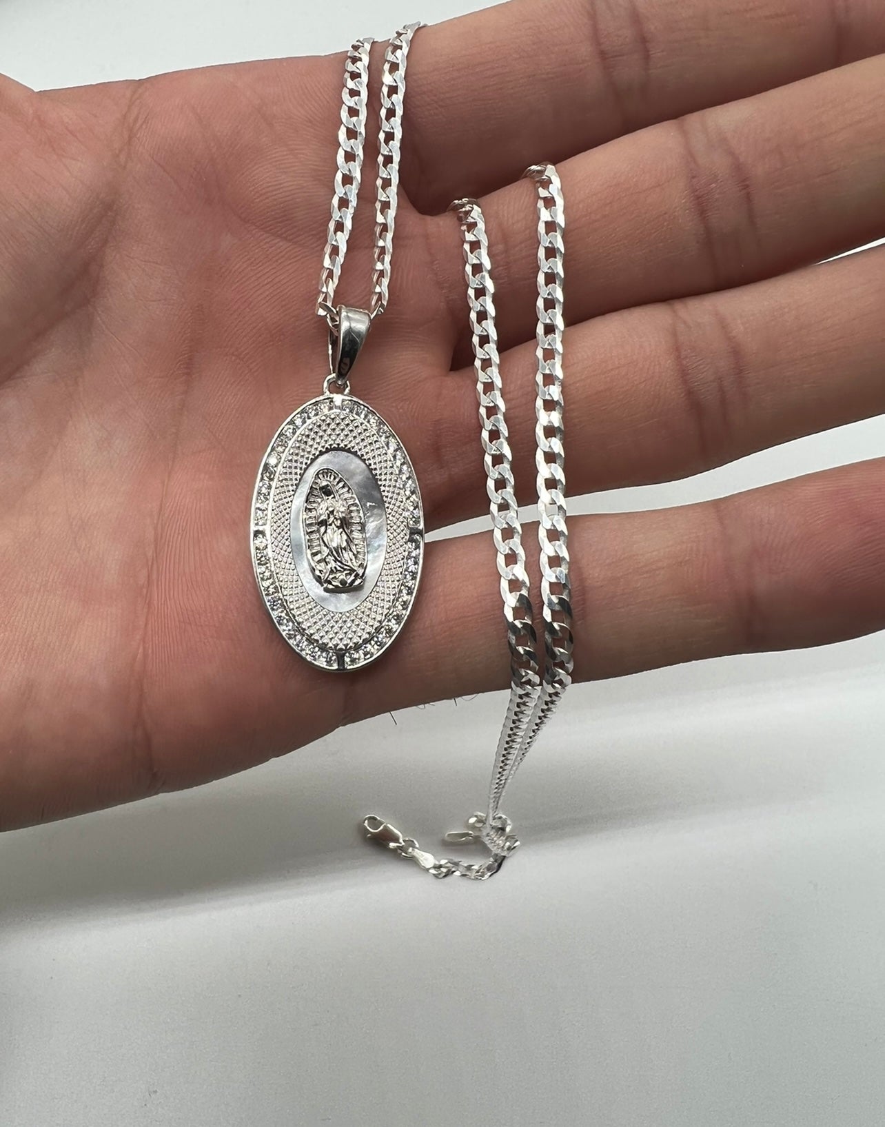 Oval Virgen Mary with Mother of Pearl In background .925 Real Silver